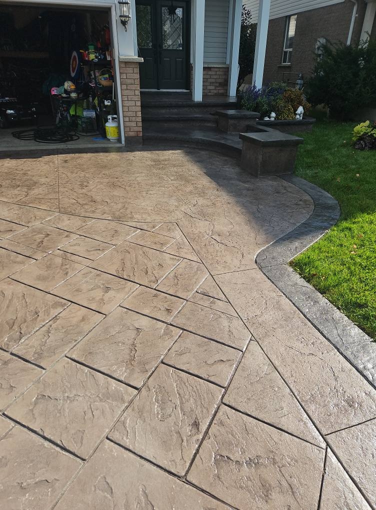 Stamped driveway with curved border and front steps