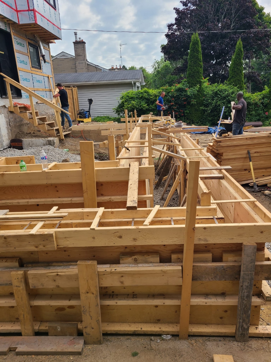 Crew building concrete formwork for a large pour — Wice Concrete process