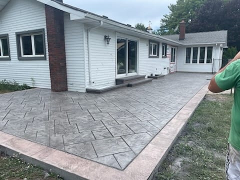 Large stamped herringbone full patio, wide view