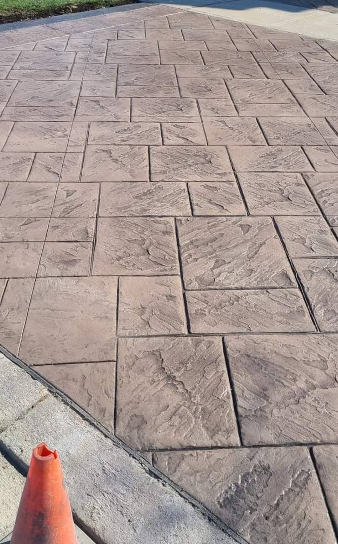 Close-up of stamped herringbone concrete pattern