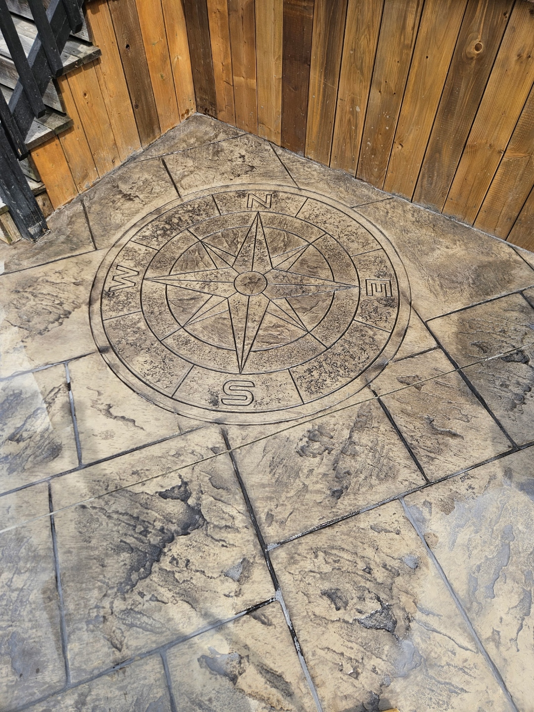 Compass rose stamped into concrete patio