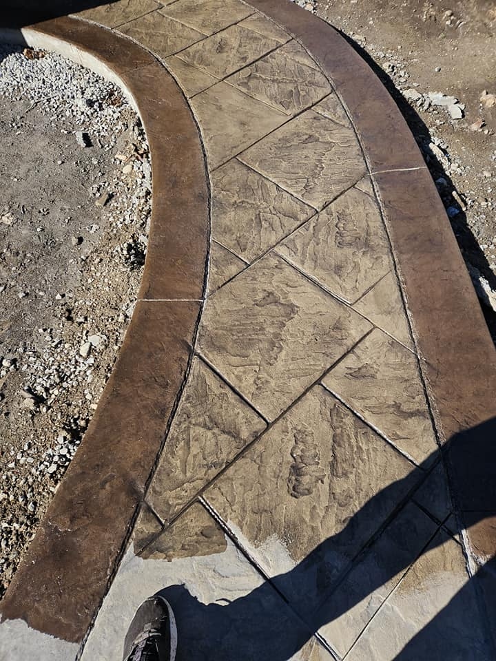 Curved stamped concrete walkway fresh pour