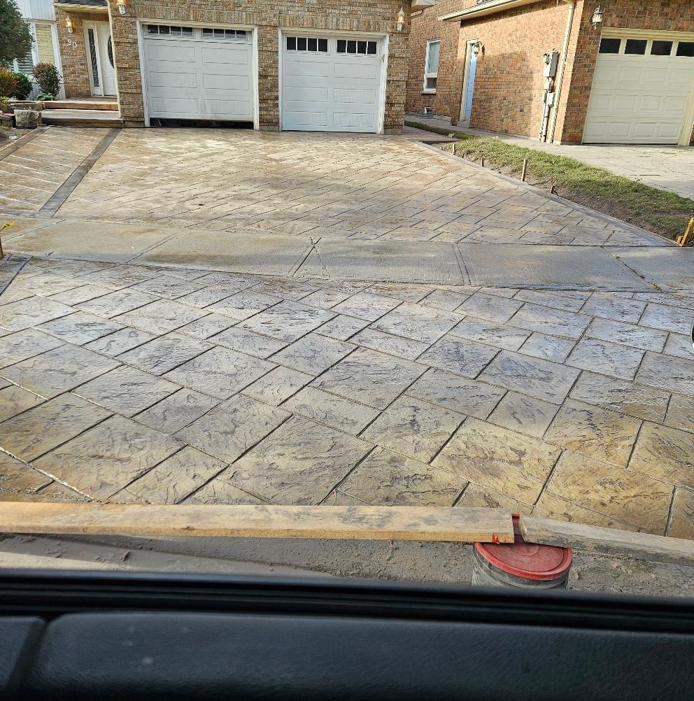 Large stamped herringbone concrete driveway