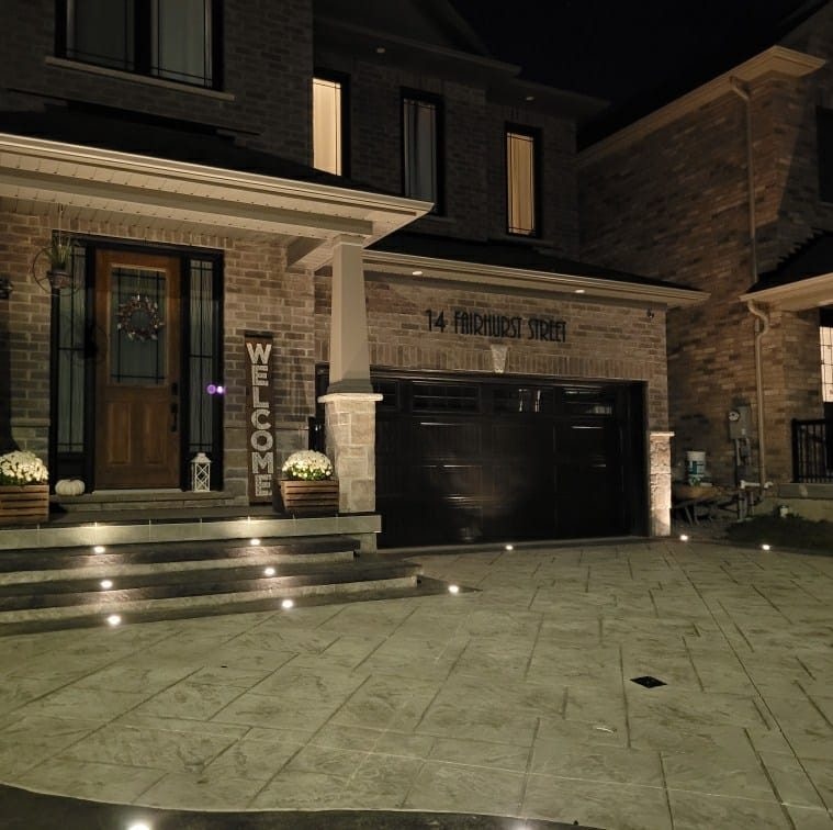 Stamped concrete driveway with step lighting
